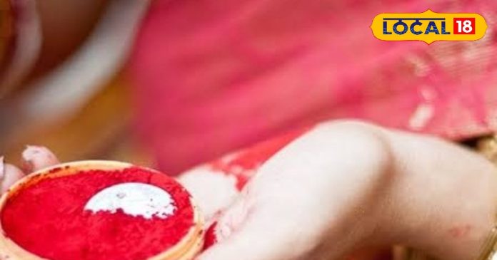 Why is the bride's face covered during donating vermilion? Why