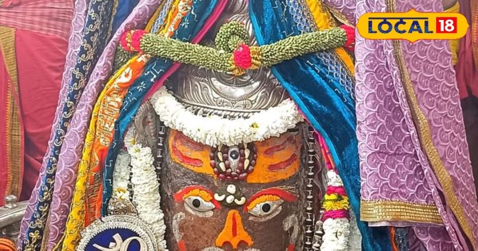 Baba decorated with sandalwood, vermilion, silver crown and Rudraksha garland,